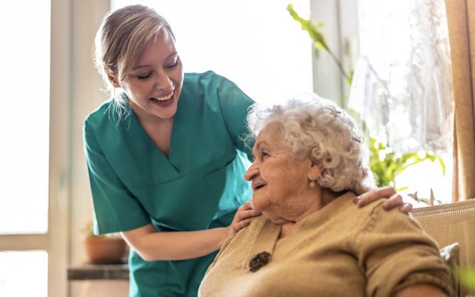 Nurse smiling with patient