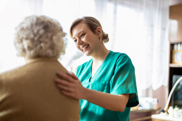 Woman nurse with elderly female patient